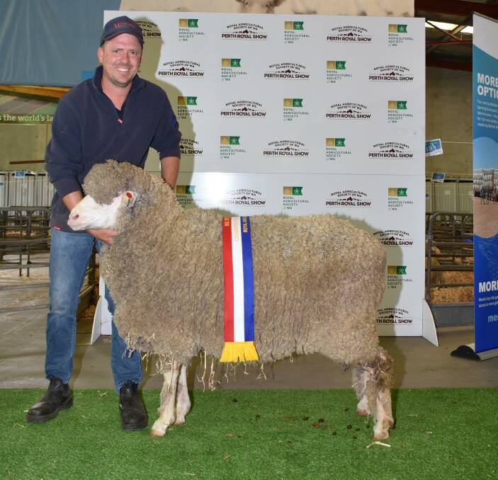 The champion unhoused/unrugged ewe was exhibited by the Manunda stud, Tammin. With the ewe was Manunda's Scott Button.