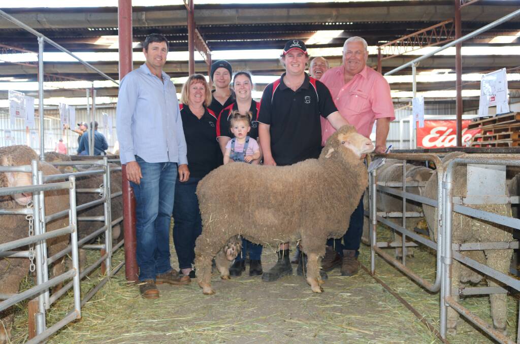 A very pleased Andrew Gillam, (left), Gabyon Pastoral, Dongara, stands with his top priced Carriber ram which he purchased for $2500 from the Steel family. Stud principal Robyn Steel, stud connection Kaleb Ebsary, principals Lauren and James Steel with daughter Brooklyn (16mo) were all excited to present the outstanding ram at this years sale. With them is Elders Merredin branch manager Andrew Peters and Elders stud stock representative Kevin Broad.