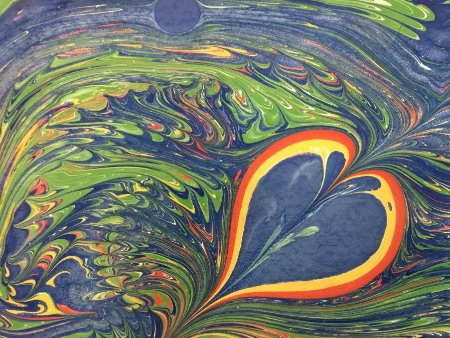  Ms Dickson enjoys experimenting with different art mediums, such as this marble painting.