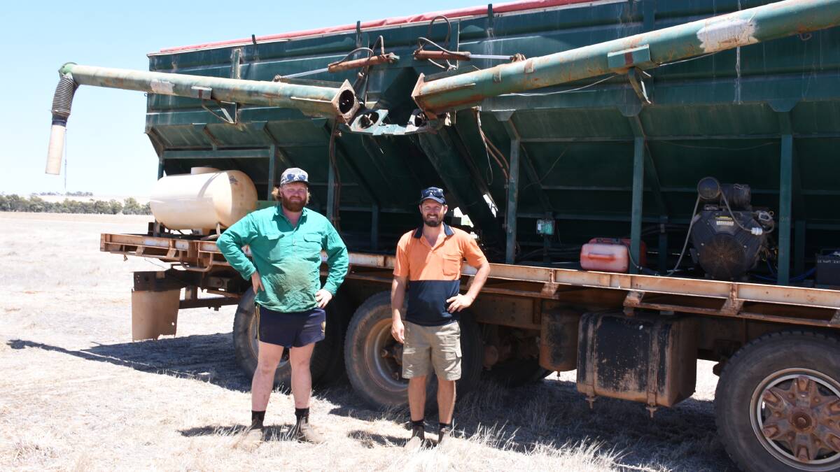 Going over the 1993 Acco truck with seed and super bin which sold for $41,000 were Thomas Morriessey (left), Watheroo and Serge Martin, Wongan Hills.