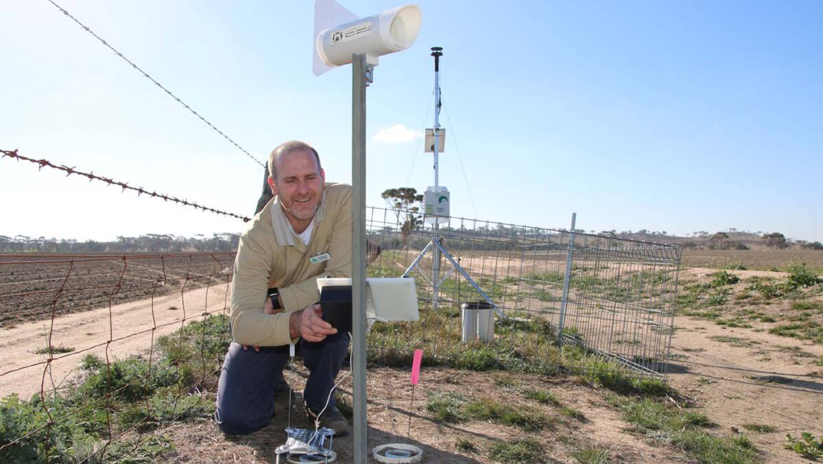 Department of Primary Industries and Regional Development research scientist Christiaan Valentine with an insect monitoring trap.