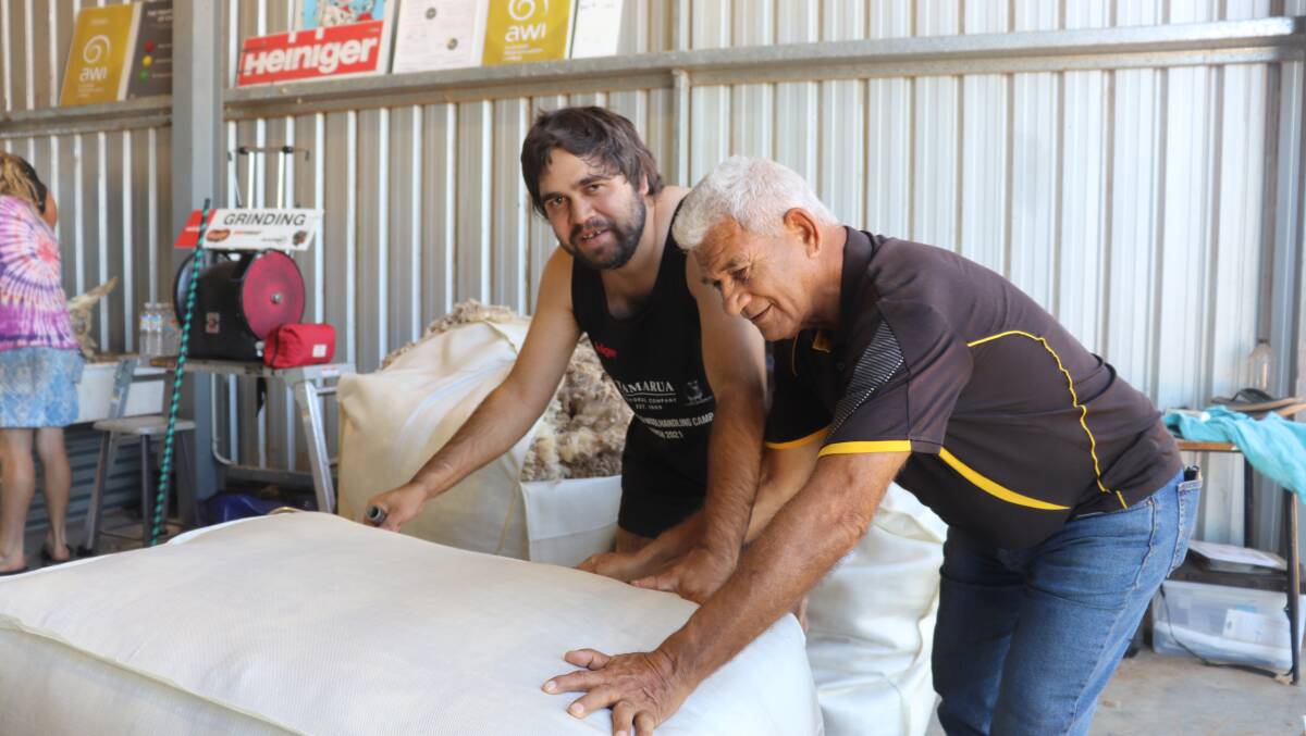 Aubrey Nelson (left), Merredin, learning from his grandfather and Aboriginal mentor Kevin May.