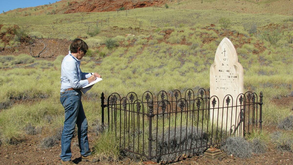  Sue Tough at the lonely grave of Margaret Straughan who died from 'heat apoplexy' in 1896 as she and her husband were on their way to Bamboo Creek gold mine north-east of Marble Bar.