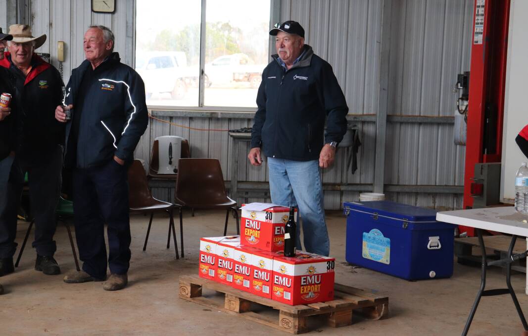 Westcoast Wool & Livestock representative Phil Barber (right) conducting the "bush chook" auction at the clearing sale to raise funds for the Lake King Primary School. It raised $450.