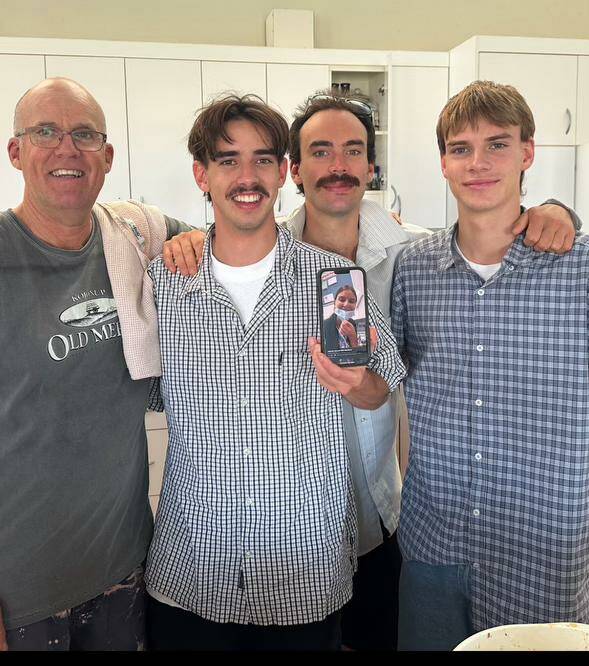 Harry Stead (second left), with his father Simon and his brothers, facetiming his sister.