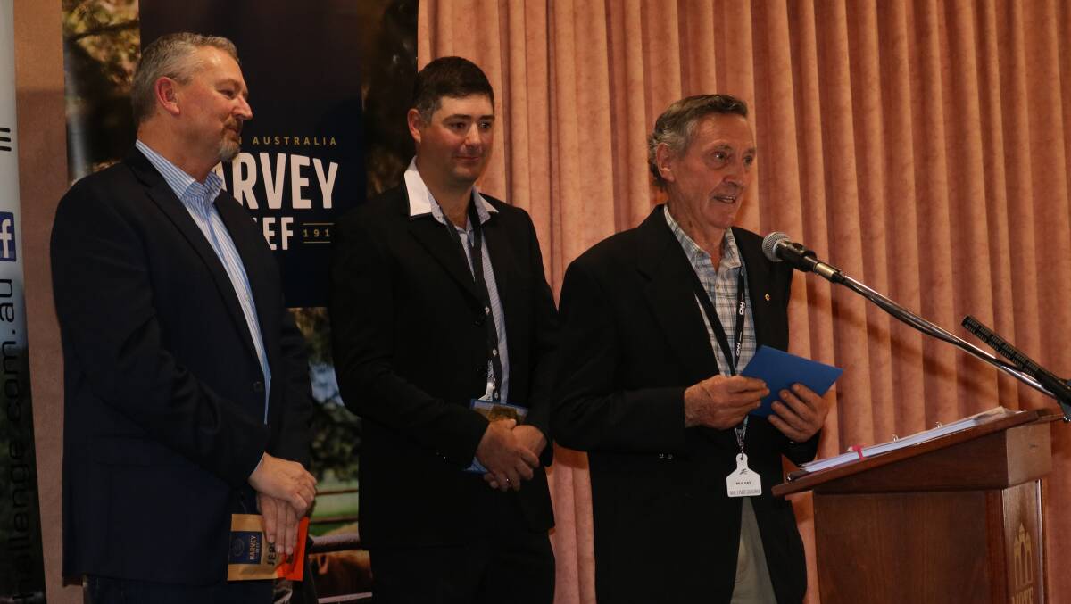 Harvest Road general manager agriculture Kim McDougall (left) and Harvey Beef Gate 2 Plate Challenge president Jarrod Carroll watch on as Murray Fouracres, Hazlemere Limousin stud, Manjimup, accepts the award for third most profitable team.