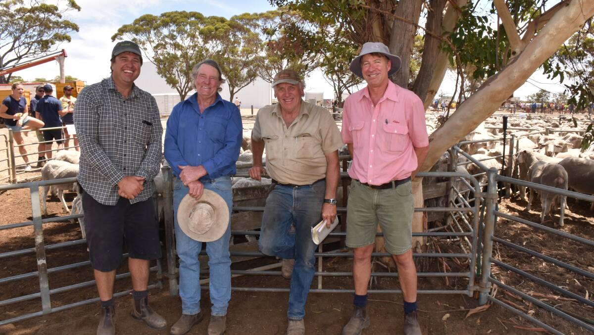 Wallinar studmaster Jerome Hardie (left), Broomehill, with $168 top price ewe buyer Peter Bunker, Kendenup, at the Lance's clearing sale at Gnowangerup last week. They are with vendor Mick Lance and his sheep classer Jeff Brown, Elders Narrogin.