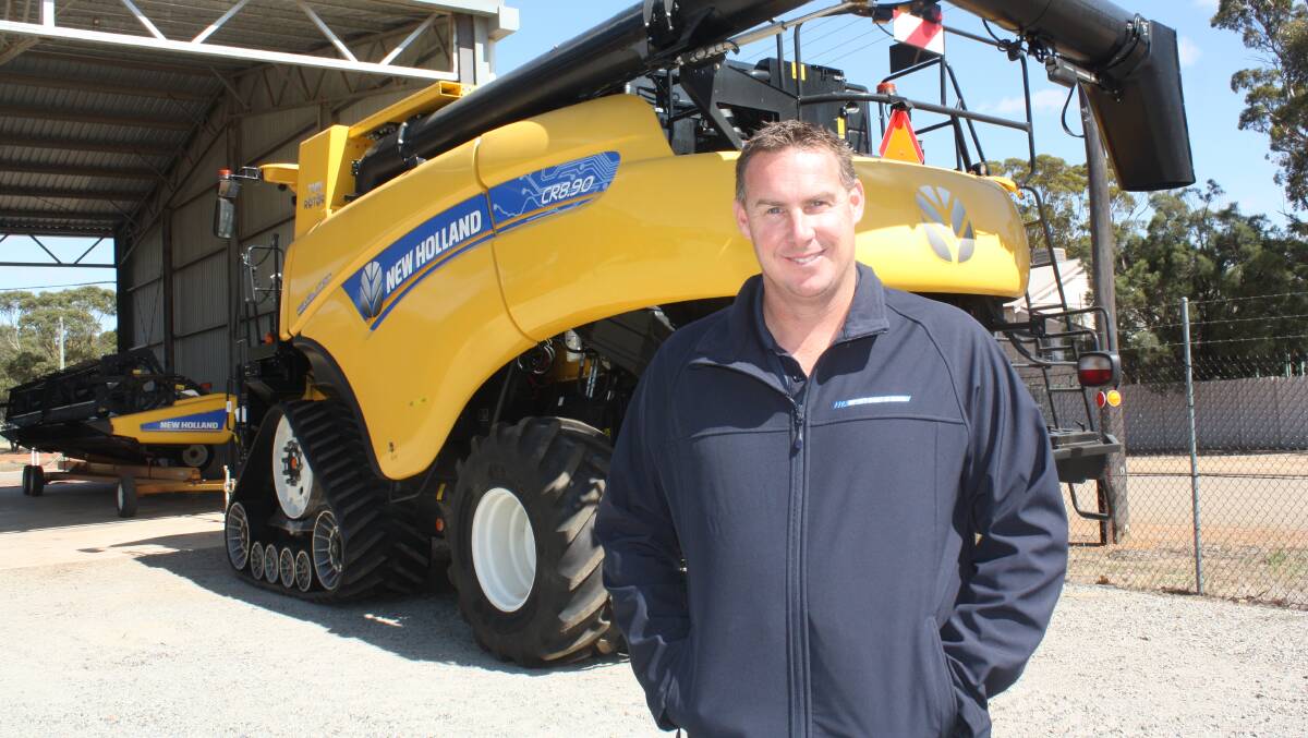 New McIntosh & Son Moora branch manager Cadeyn Catto in front of a New Holland CR header last week fitted with the latest vertical Integrated Harrington Seed Destructor. "There was a limited production build this year and we've managed to get quite a few fitted to new and used CR models," he said. "We've delivered most machines so we're ready for the harvest which will be cranking soon."