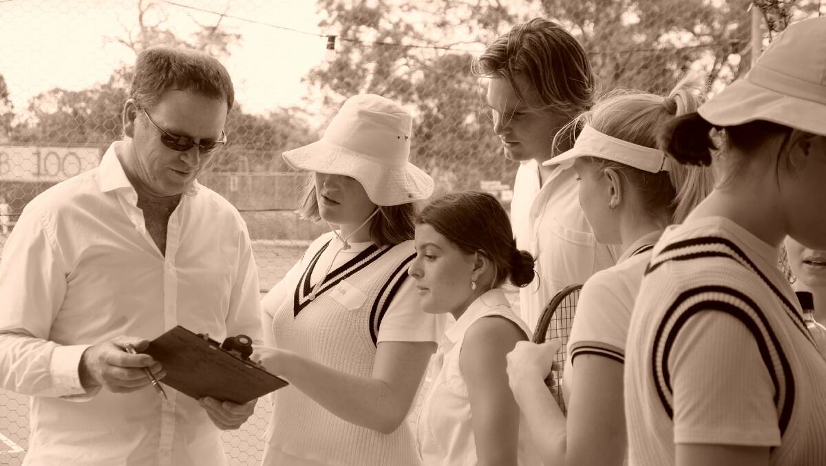 Mark Addis with a line-up of young players from the Tenterden Tennis Club.