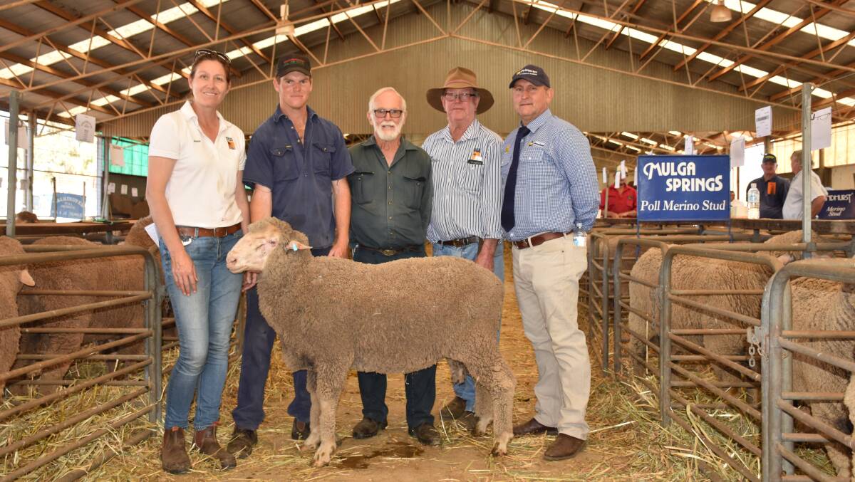 Mulga Springs studmaster Jessica Horstman holds the $2800 second top price ram at Monday's Northampton ram sale. She is with buyers Lloyd Cripps and father Peter, West Binnu, father Chris Hasleby and Primaries auctioneer Craig Williams. Mulga Springs achieved the day's $1226 top average.