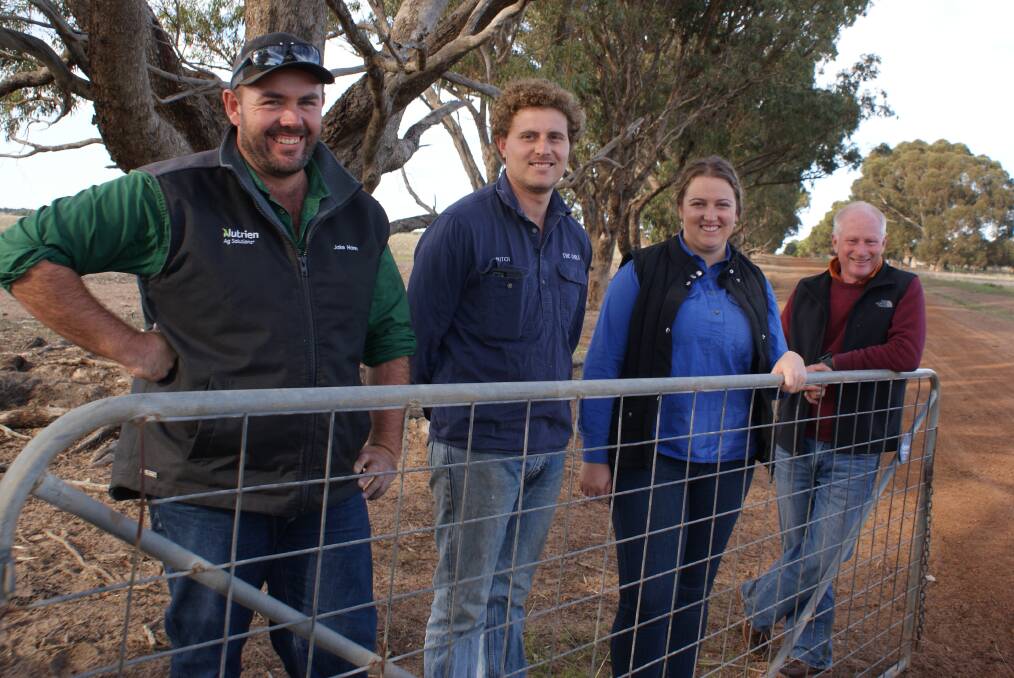 The Russell family, JA Russell Pty Ltd, Esperance, won the WAMMCO Producer of the Month award for April, discussing the win were Nutrien Livestock, Esperance representative Jake Hann (left) farm Mitch Greaves and partner Demi and owner John Russell .