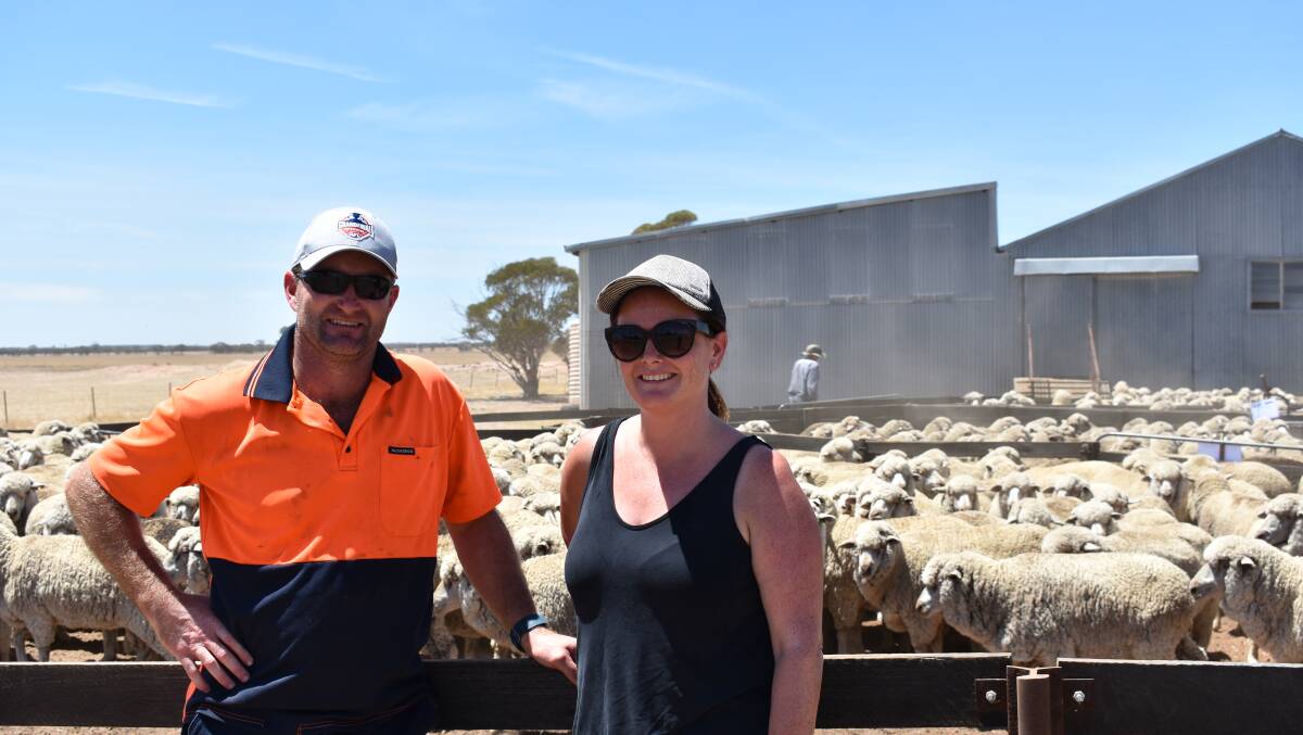 Garrick (left) and Nicole Connelly, Corrigin, purchased the offering of 168, August shorn, white tag Merino ewes for $131 a head.