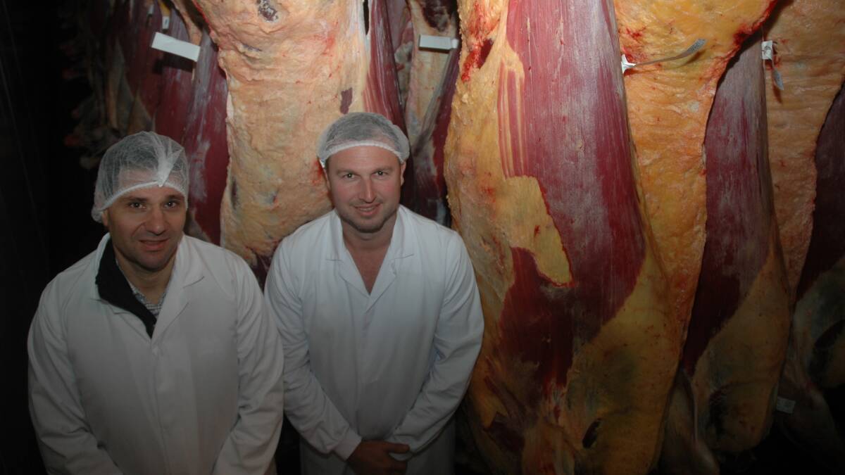 Western Meat Packers Group chief executive officer Andrew Fuda (left) and Western Meat Processors general manager Jamie Warburton with beef sides in the chiller at Cowaramup.
