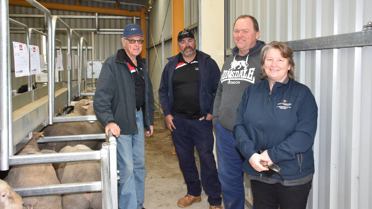  Inspecting the line-up of Dohne rams from the C-View stud, Esperance, before the sale were stud principals Laurie (left) and Jason Lowe with Bevan and Kylie Bailye, Salmon Gums. In the sale the Bailyes purchased three C-View rams all at $600.