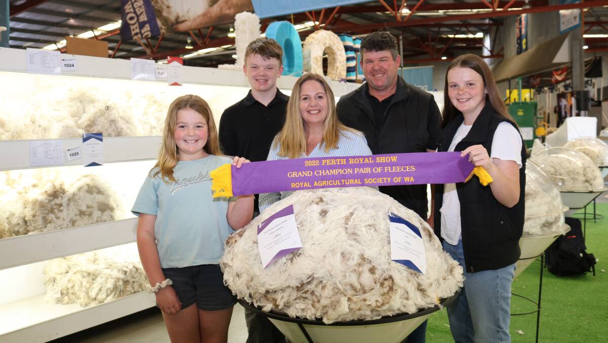 Rangeviews Erin (left), 10, Tom, 16, Melinda, Jeremy and Gemma King, 14, Darkan, were excited to find they had won grand champion pair of fleeces.