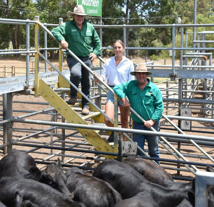 Nutrien Livestock, Bridgetown agent Ben Cooper (left), looked over the Muir family's run of Angus steers in the sale with Diana and Mark Muir, GD Muir & Co, Mordallup Angus stud, Manjimup. In the sale the family sold nine pens of steers (107 head) to the day's top price of $1850.