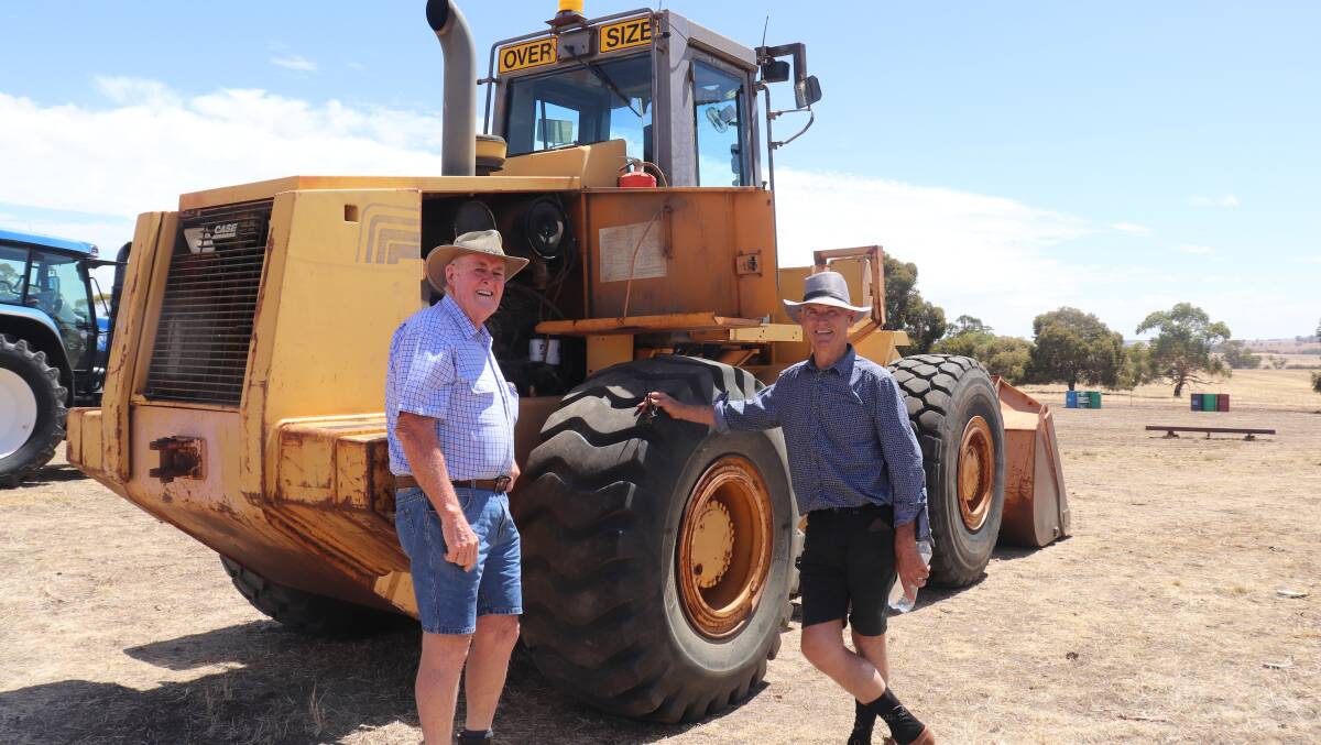 Dan Ryan (left) and Rob Sachse, both from York, inspect the 1990s 16 tonne Case 821B wheel loader.