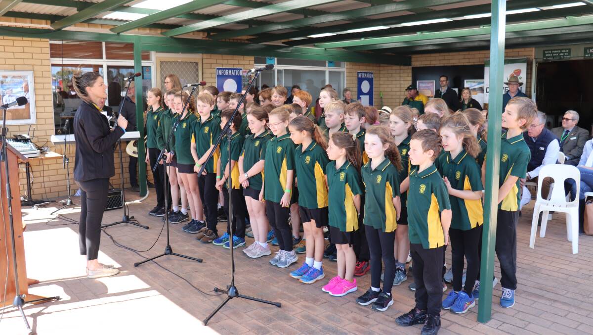 The Dowerin District High School choir performing for the crowd at the official opening of the Dowerin GWN7 Machinery Field Days.