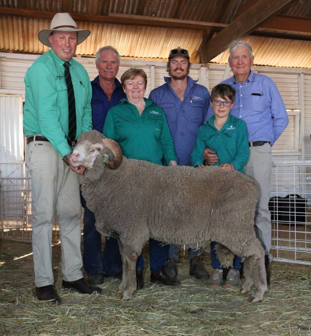 Cranmore sale auctioneer Grant Lupton (left), Nutrien Livestock Wongan Hills, buyers Michael, Tracy and Blair Humphry, 'Pankee', GM Humphry & Co, Walebing, Oliver Lefroy and his grandfather 'Baa' Bruce Lefroy, Cranmore stud, Walebing, with the $4000 top-priced Merino ram.