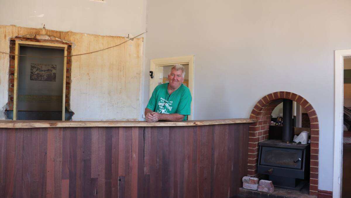 Mr Duffy behind the newly renovated bar counter, with lovely jarrah details.