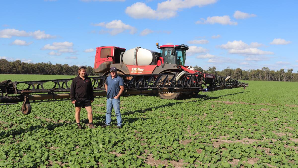 Mt Barker farmer Kieran Allison (left), with McIntosh & Son, Albany, sales consultant Michael Fethers in front of the Miller sprayer in a Pioneer canola crop.