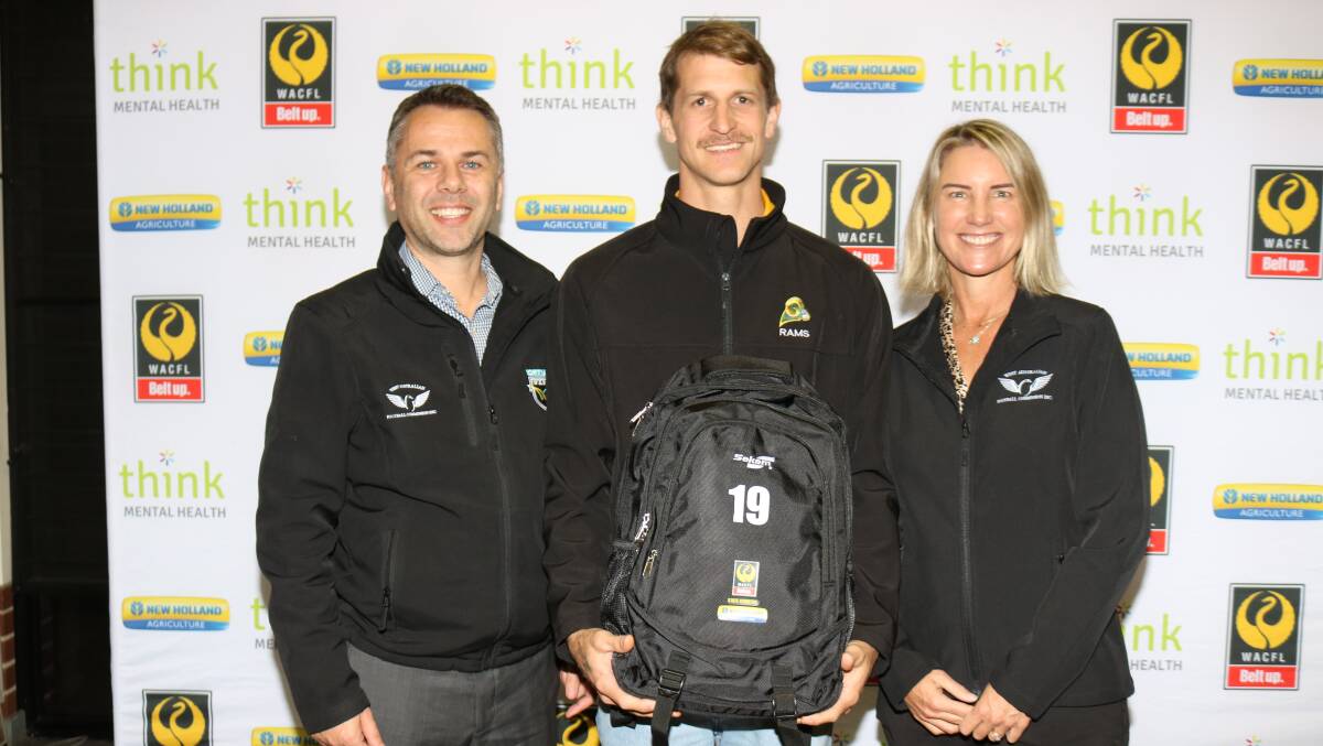 WA Football Commission chief executive officer Michael Roberts (left) and commissioner Amber Banfield, presented WA country football team co-captain Kingsley Smith, Northampton Rams, with his team back pack. The other co-captain named was Jordan Delbridge, Mines Rovers, Kalgoorlie.