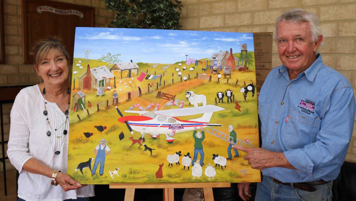 Busselton artist Jenny Taylor with local pilot Greg Hall, who points to himself depicted in the artwork.