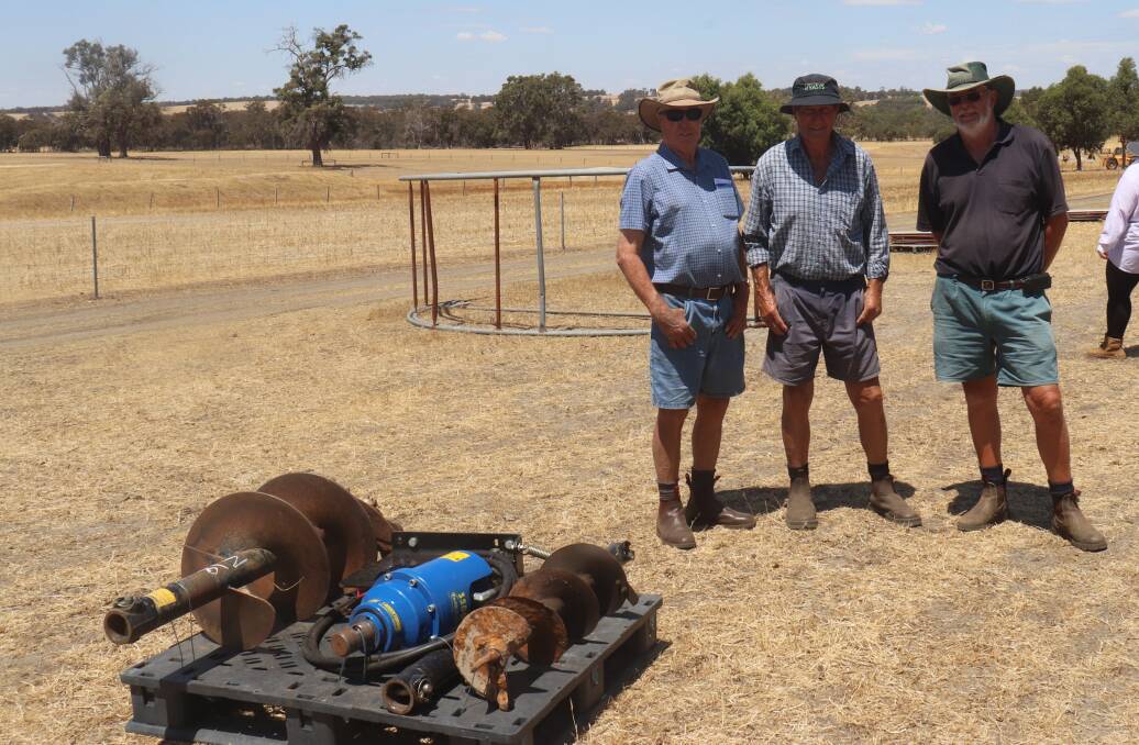  Boyup Brook farmers John Chapman (left) and Lance and Steven Lee-Steer, inspect some of the lots on offer.