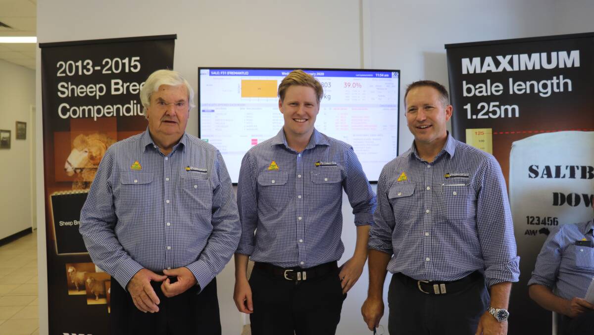 Primaries of WA wool marketing trainee Rohan Gaunt (centre) at the Western Wool Centre with wool representative and auctioneer Terry Winfield (left) and wool manager Greg Tilbrook.