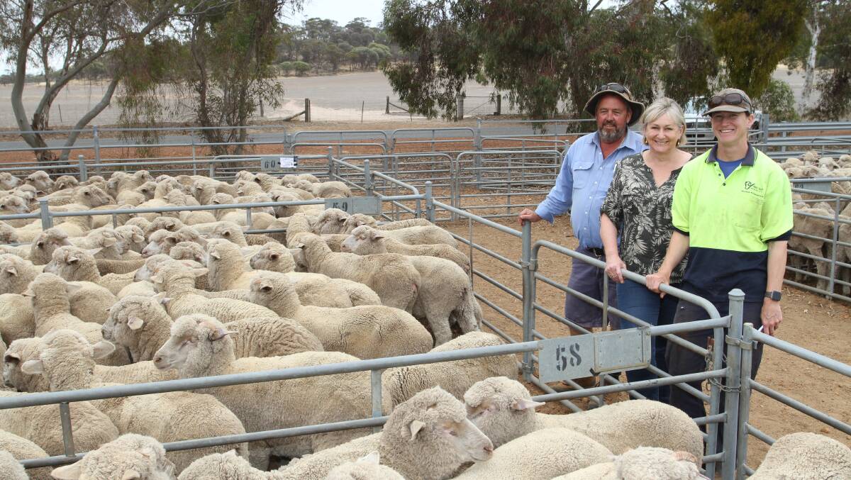 Andrew Kitto (left), Dyson Jones (AWN) with vendors Vicki O'Neill-Gray and Tahryn Trevenen, Ken Gray & Co, High Valley Merino stud, Tarin Rock, with the Gray family's draft of 305 August shorn High Valley blood wether lambs that sold for $126 at the sale.