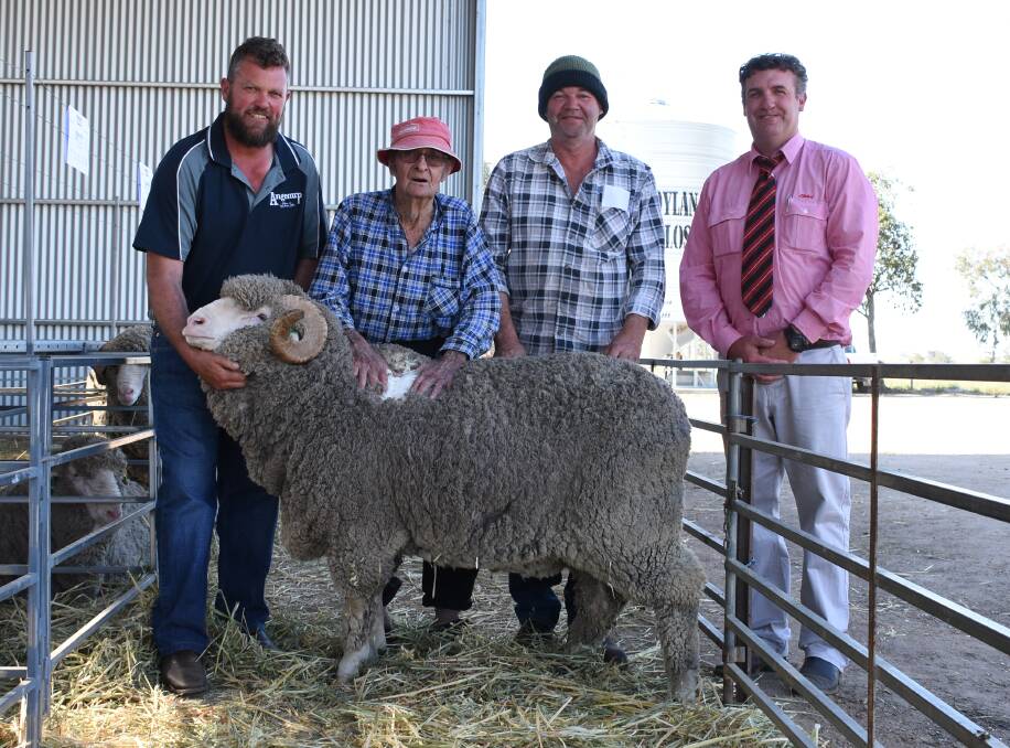 The top price for a Merino ram in the sale was $5200 for this sire. With the ram were Angenup co-principal Paul Norrish (left), buyer Tom Marshall and Geoff Pope, TG Marshall, Cranbrook and Elders Kojonup agent Jamie Hart.