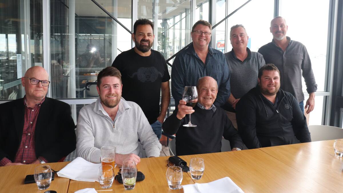 John Kirkpatrick (centre with wine glass) retired during 2020 after a distinguished 63-year career in the wool industry. With him are Westcoast Wool & Livestock colleagues Gavin O'Dwyer (left), Justin Haydock, Luke Grant, Brad Faithful, Danny Ryan, Danny Burkett and Reuben Small (in front).