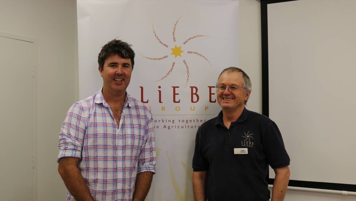 New Liebe Group president Blayn Carlshausen (left), with outgoing president Ross Fitzsimons.