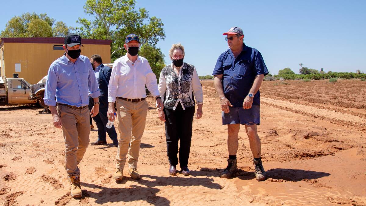 Caiden plantation owner Eddie Smith (right), showed Premier Mark McGowan (left), Emergency Services Minister Fran Logan and Agriculture and Food Minister Alannah MacTiernan the damage caused to his property during the flood.