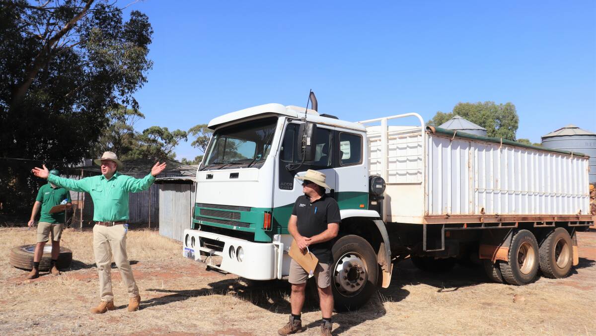  Nutrien Ag Solutions auctioneer Grant Lupton is animated when selling the 2005 Iveco 6x4 former garbage compactor converted to tipping try with grain bin. It eventually sold for $70,000 after spirited bidding.