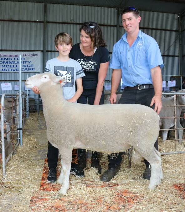 The proceeds of the sale of this Poll Dorset ram went to the Albany Community Hospice. Pictured with the ram were buyers Mitchell (left) and Wanda Coombe, Kronkup, with Ridgetop stud principal Denam Carter, Narrikup.