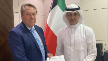 Federal MP for O'Connor, Rick Wilson, delivers the letter about live sheep exports by sea to Ziad Abdullah Alnajem, Government of Kuwait.