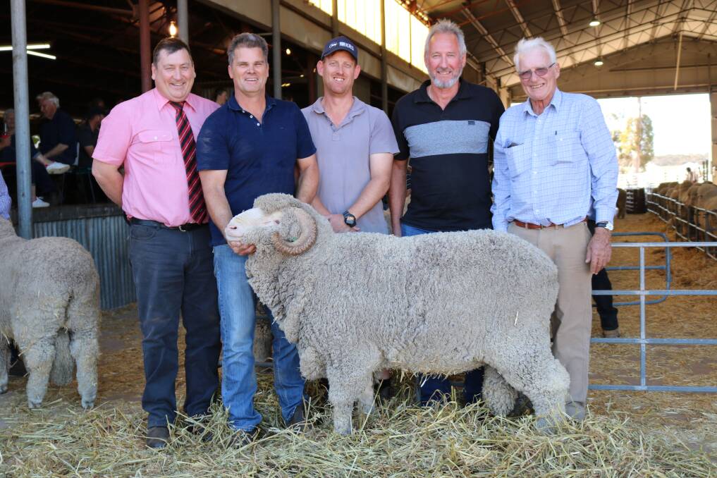 With the $12,000 top-priced East Mundalla Merino ram were Tim Spicer (left), Elders stud stock, East Mundalla co-principal Ross Robinson, buyers Colin and Marc Ball, Dongolocking Farming, Dumbleyung and Philip Gooding, East Mundalla.