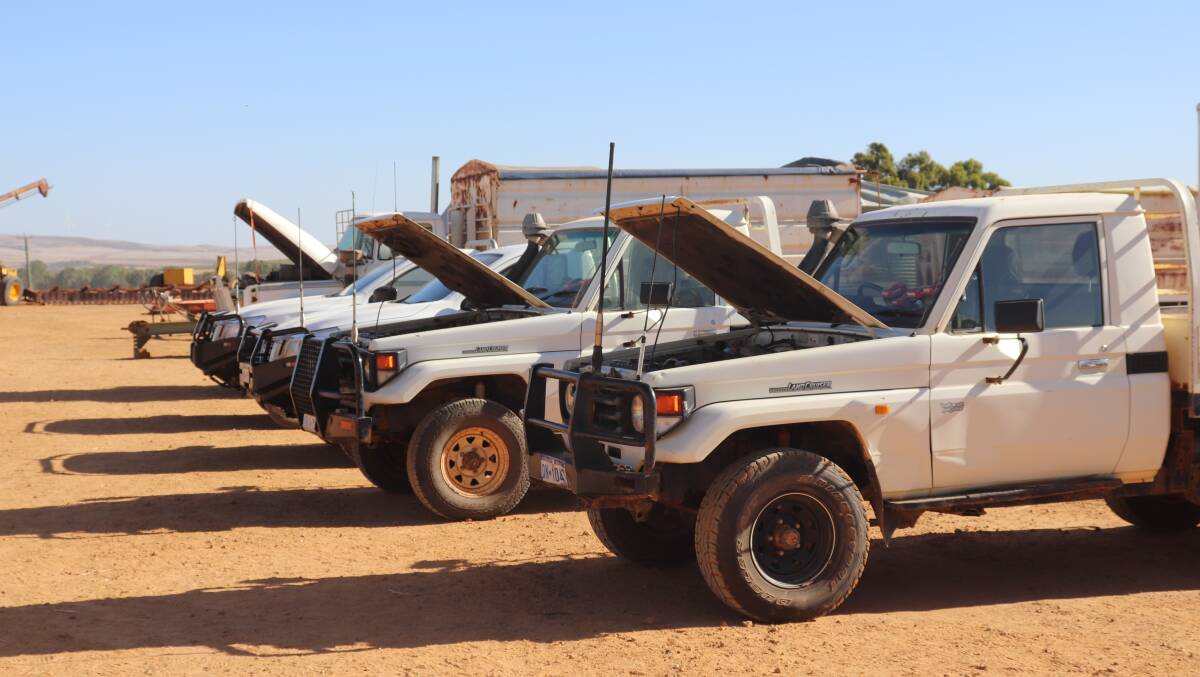 The line-up utes on offer at the Nutrien Ag Solutions Black Arrow Agriculture clearing sale at Badgingarra last week. Two Nissan Navara DX utes sold for $28,500 and $31,500 respectively, while the two 2004 Toyota Landcruisers sold for $20,000 each.