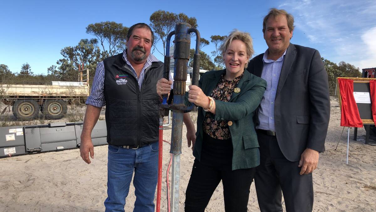 Cascade sheep producer Scott Pickering (left) with State Agriculture Minister Alannah MacTiernan and Labor MP Darren West driving into the ground the first post for the Esperance Extension to the State Barrier Fence. 