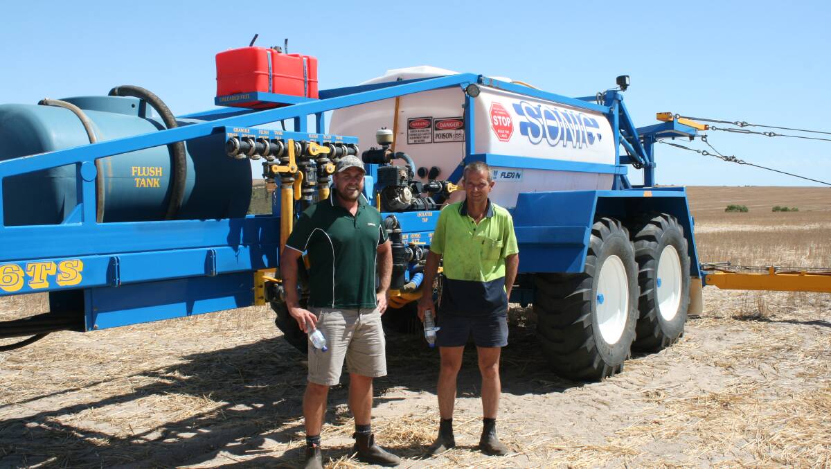 Landmark division manager Scott Piper (left), Geraldton with Will Robinson, Kojonup, who purchased the Sonic boomspray on behalf of a phone bidder for $128,000.