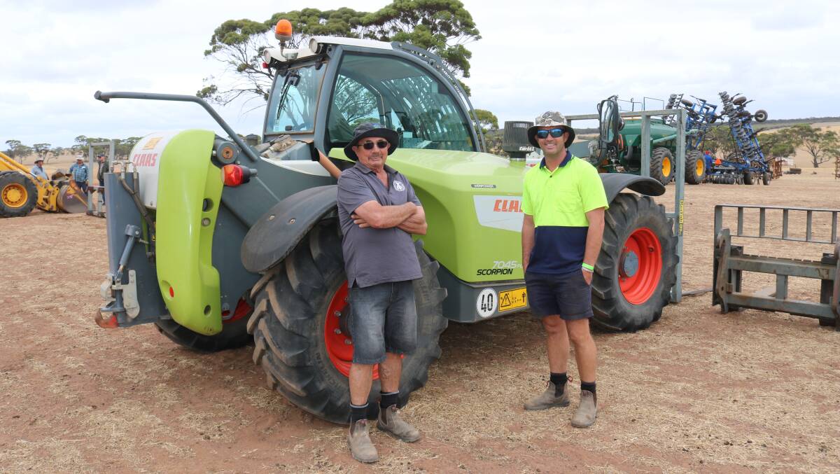 John Davidson (left), Dumbleyung and Peter Davidson, Tincurrin, with the CLAAS 7045 Telehandler that sold for $118,000.
