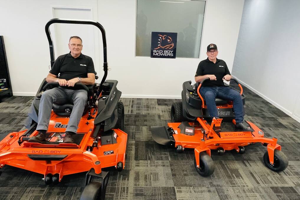  Dealer principal Paul McGovern (left) and fixed operations manager David Tritt with a couple of the Bad Boy Mowers.