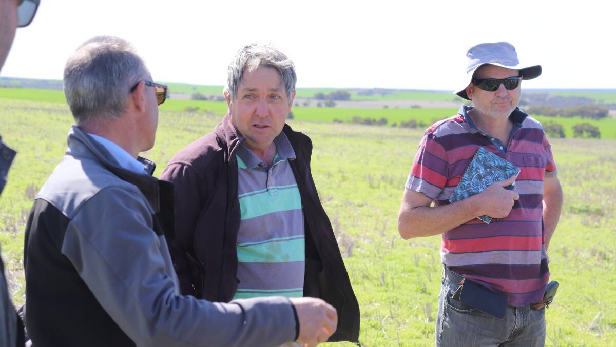  Department of Primary Industries and Regional Development senior research officer  pasture breeding, agronomy and ecology Angelo Loi (left) with Badgingarra pasture grower David Paish and members of the Pasture Tour from South Australia at his property.