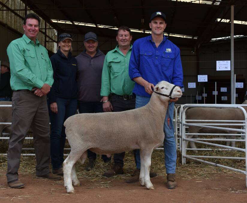 With the $3100 top-priced Yonga Downs White Suffolk ram of the sale were Nutrien Livestock auctioneer Mark Warren (left), buyers Kate and Braden Johnston, Nyabing, Nutrien Livestock Breeding representative Roy Addis and Yonga Downs stud principal Brenton Addis.
