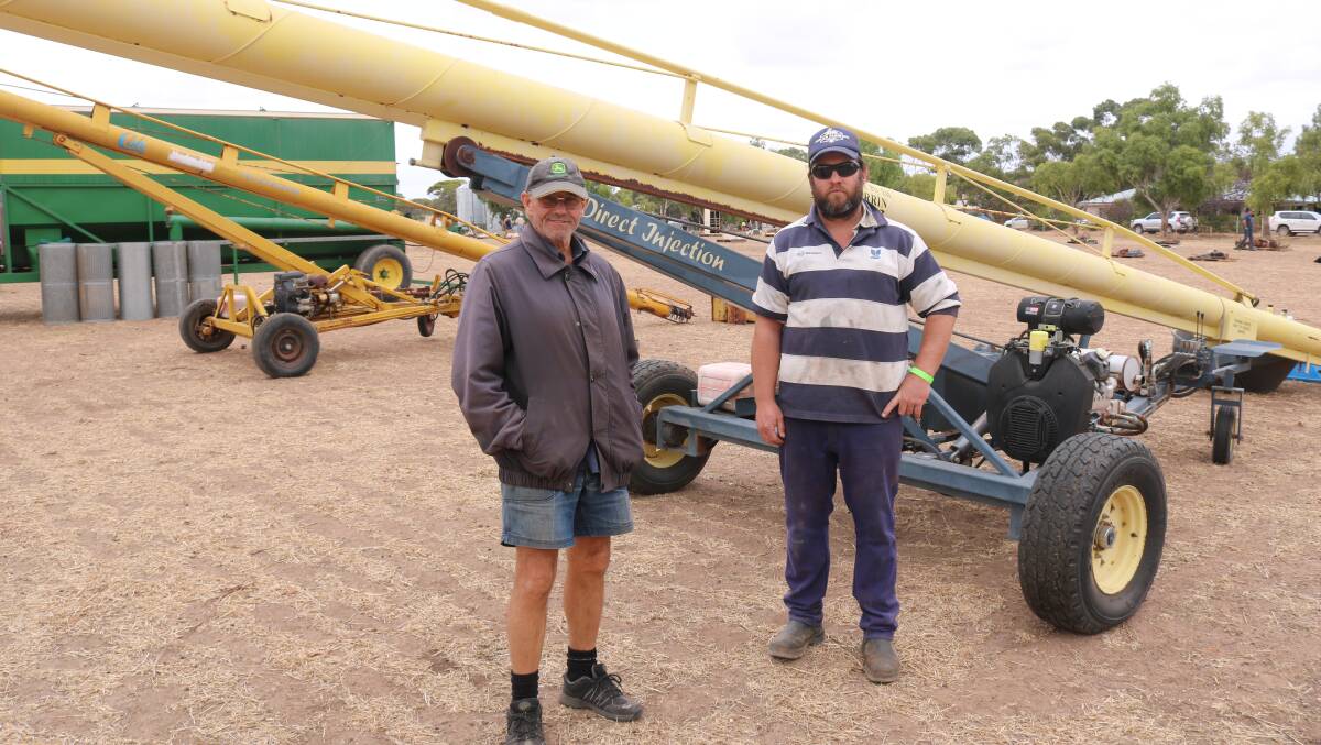 John Dye (left) and Todd Green, Broomehill, with the AgriFab auger that sold at $30,000.