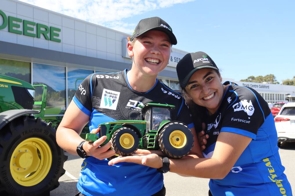 Western Force womens team players, Ms Wulff (left) and Ms Bekir Fuente found a John Deere tractor more their size.