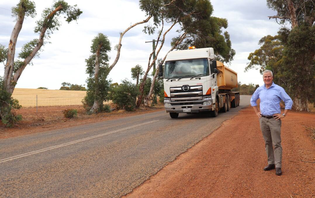 Deputy Prime Minister Michael McCormack has a close encounter with a truck beside the Mogumber-Yarawindah Road last Thursday. A 2.7 kilometre widening of the road about to start will be the pilot for a series of integrated secondary freight route upgrades across the Wheatbelt.