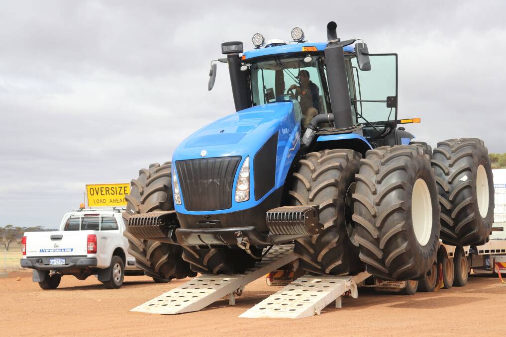  The big New Holland T9.670 being unloaded off the truck.