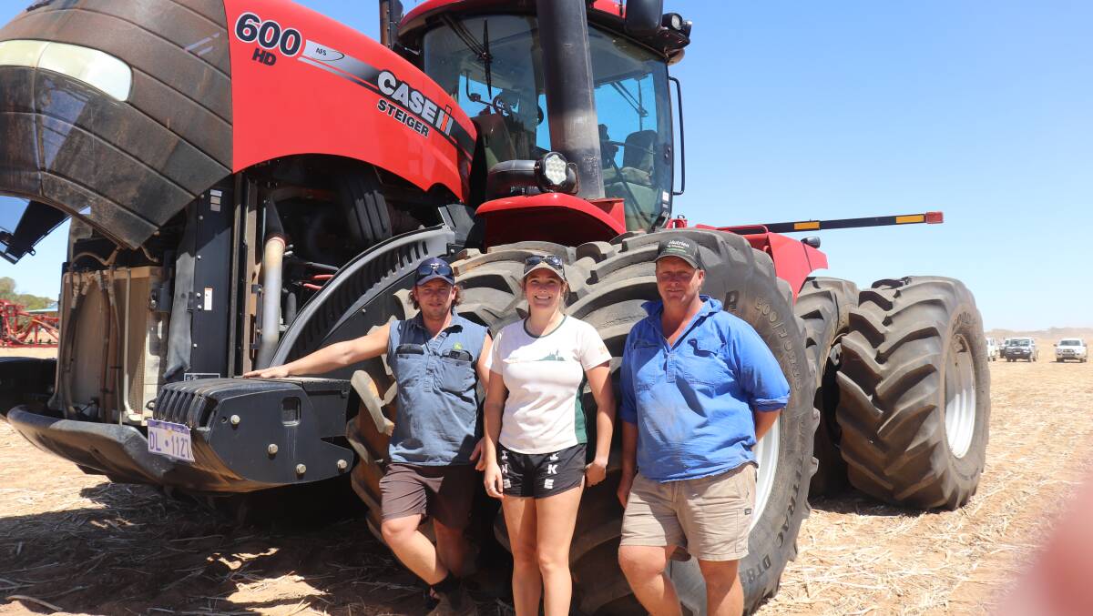 Michael Graham (left), Kojonup with farm workers Ashley Gartrell, Perth and Josh Smith, Kalannie. Mr Smith worked for Bresland Farming for seven years and had bought a house in town, but has found work on a nearby property. The 2013 Case IH 600HD Steiger tractor behind them was second top-priced item of the sale at $414,000.
